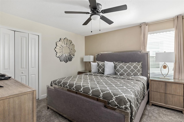 bedroom featuring carpet floors, a closet, and a ceiling fan