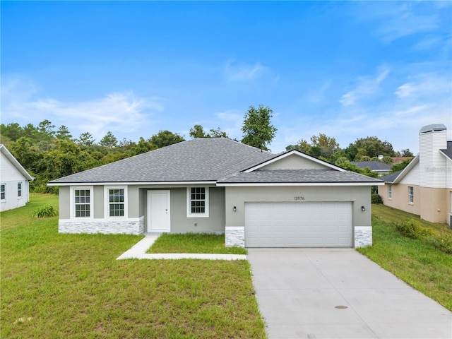 ranch-style home with a front yard and a garage