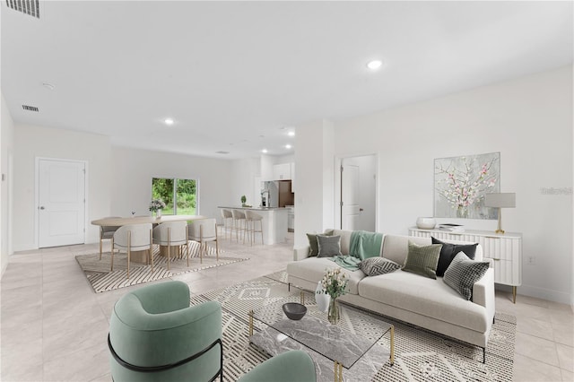 living room featuring light tile patterned flooring