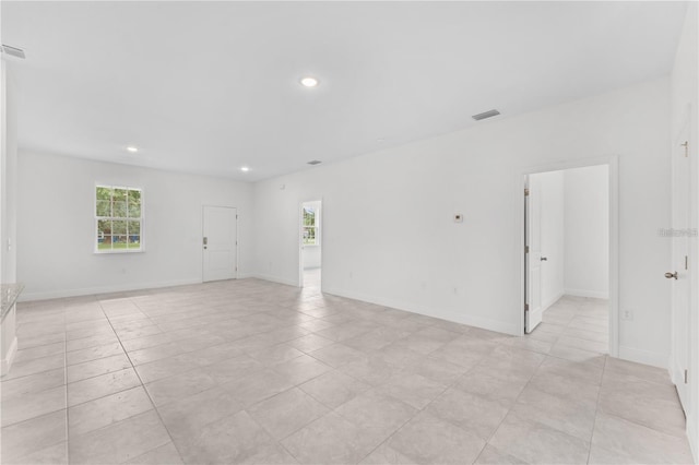 unfurnished room with light tile patterned floors