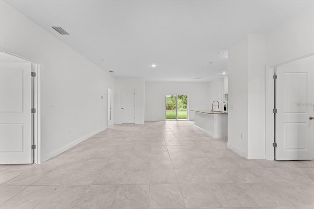 empty room featuring light tile patterned floors