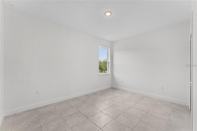 empty room with light tile patterned floors