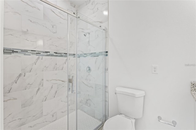 bathroom with toilet and walk in shower