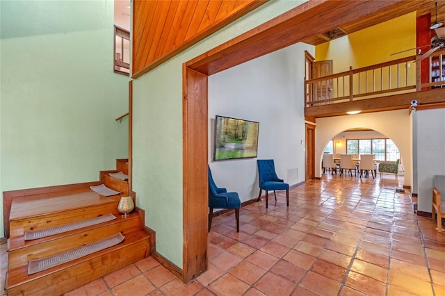 stairs with wooden ceiling