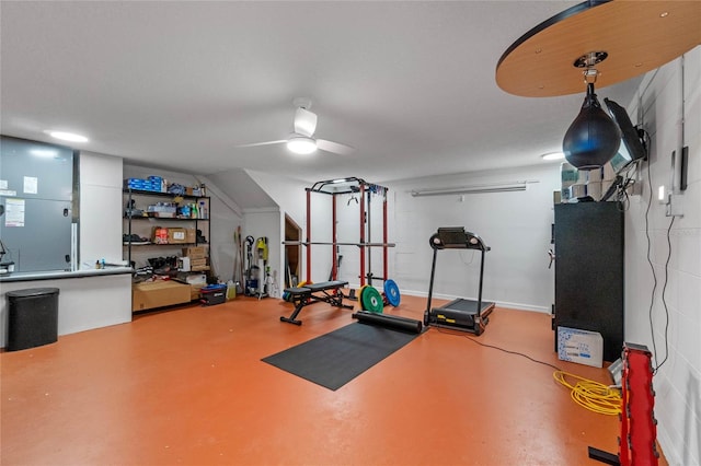 exercise area with heating unit and ceiling fan