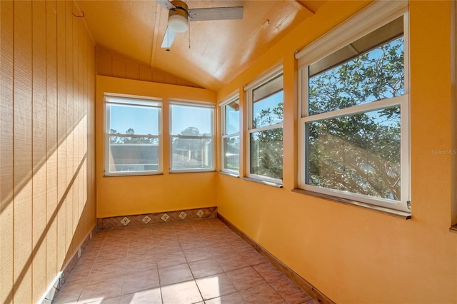 unfurnished sunroom featuring ceiling fan and lofted ceiling