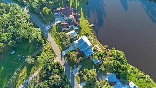 birds eye view of property featuring a water view