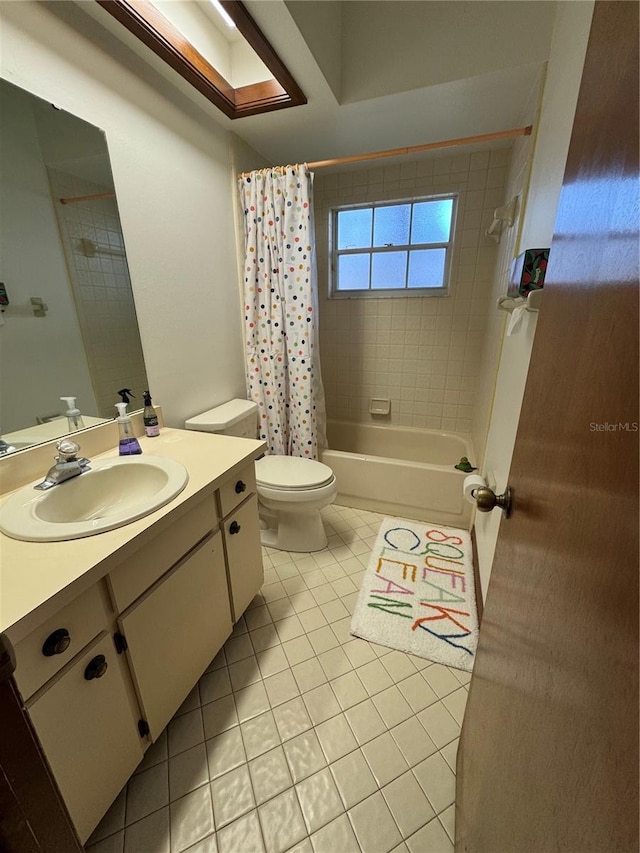 full bathroom with shower / bath combo with shower curtain, toilet, vanity, and tile patterned flooring