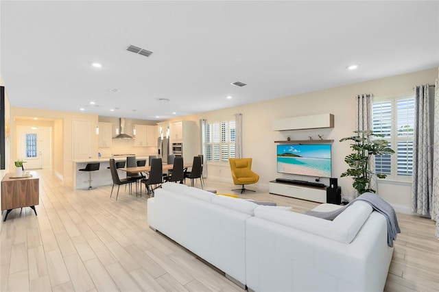 living room with light hardwood / wood-style floors