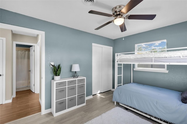 bedroom featuring ceiling fan and hardwood / wood-style flooring