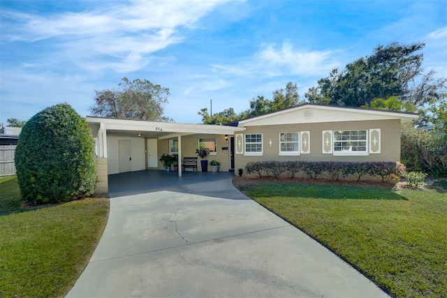 single story home with a front lawn and a carport