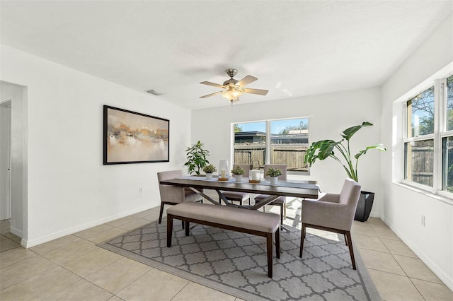 dining area featuring ceiling fan and light tile patterned floors