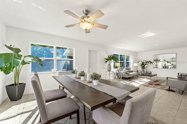 dining room with ceiling fan and light tile patterned flooring