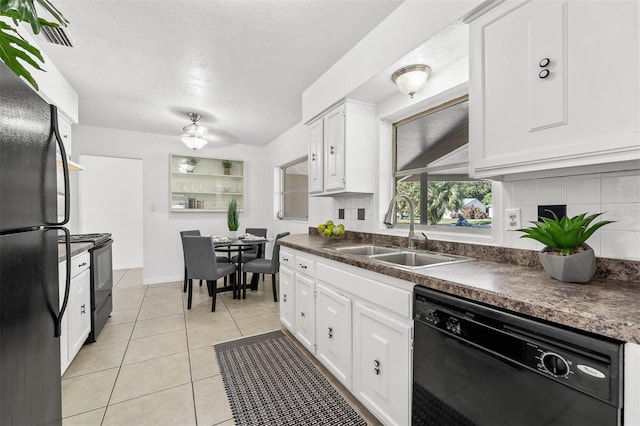 kitchen featuring black appliances, white cabinets, sink, ceiling fan, and light tile patterned floors