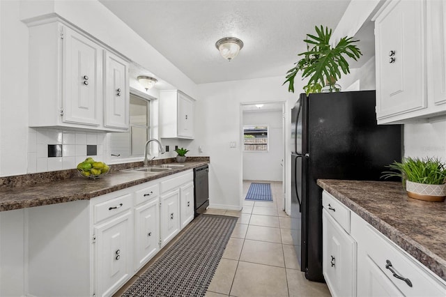 kitchen featuring white cabinets, a textured ceiling, sink, and black appliances