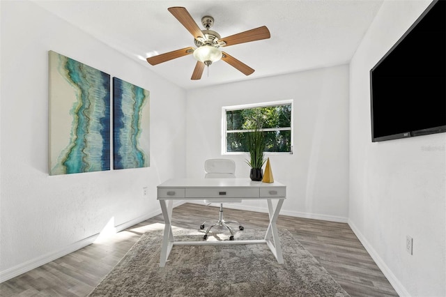 office space with wood-type flooring and ceiling fan