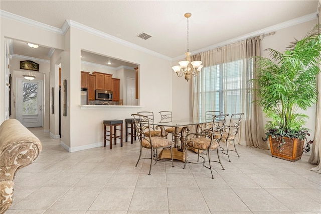 dining area with crown molding, plenty of natural light, light tile patterned floors, and a chandelier