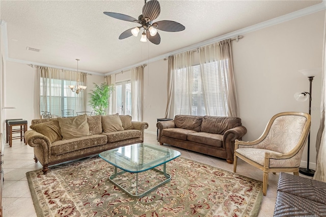 living room featuring a textured ceiling, crown molding, light tile patterned floors, and ceiling fan with notable chandelier