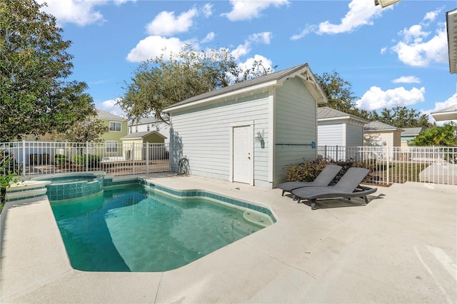 view of pool featuring a patio area and an in ground hot tub