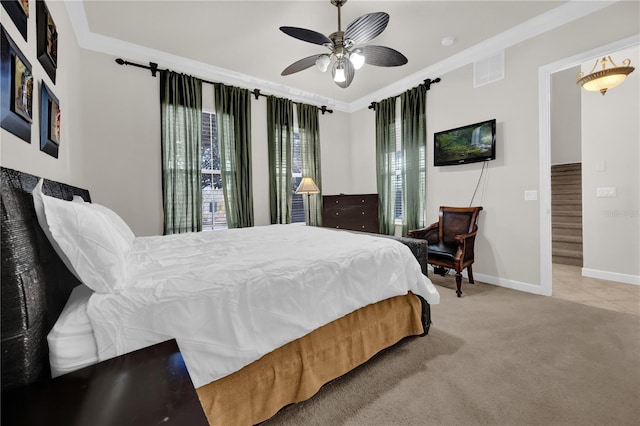 carpeted bedroom with crown molding and ceiling fan