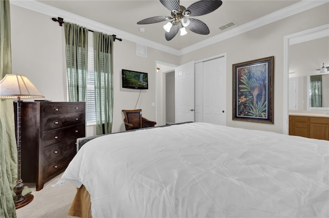 bedroom with ceiling fan, a closet, carpet, and ornamental molding