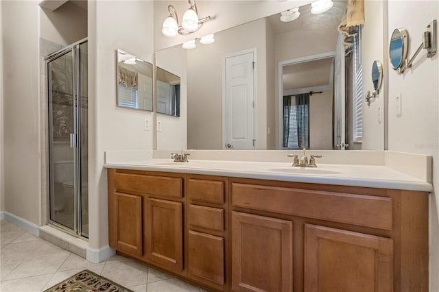 bathroom with tile patterned flooring, vanity, walk in shower, and a notable chandelier