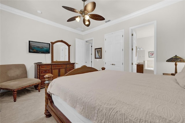 carpeted bedroom with connected bathroom, ceiling fan, and ornamental molding