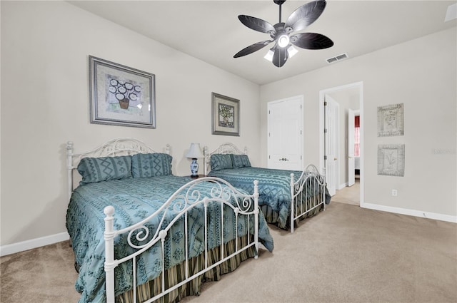 carpeted bedroom with ceiling fan