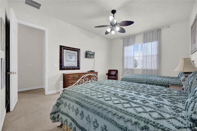 bedroom featuring ceiling fan and light carpet