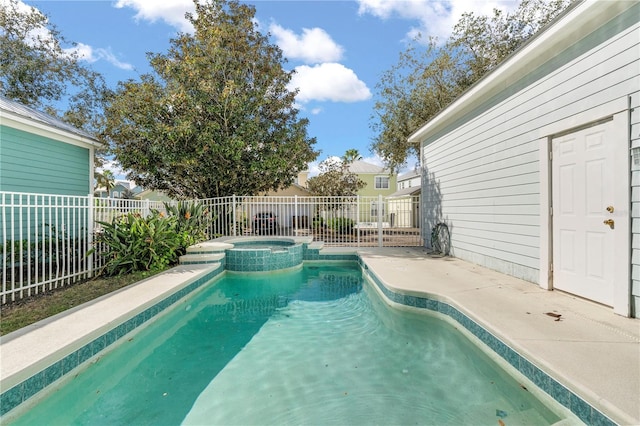 view of swimming pool featuring an in ground hot tub and a patio