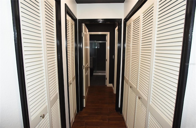 hall with dark hardwood / wood-style flooring