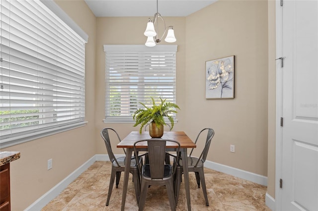 dining area with an inviting chandelier and plenty of natural light