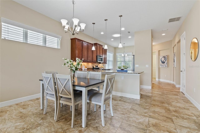 dining room featuring an inviting chandelier