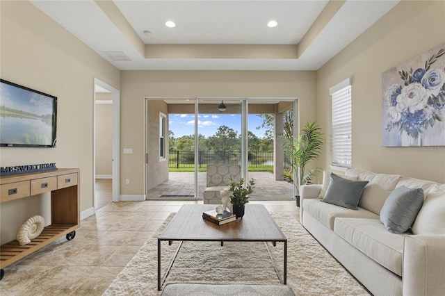 living room with a raised ceiling