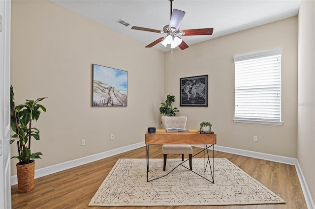 office area with hardwood / wood-style floors and ceiling fan