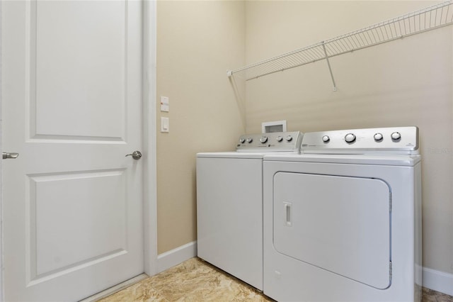 washroom with washer and dryer