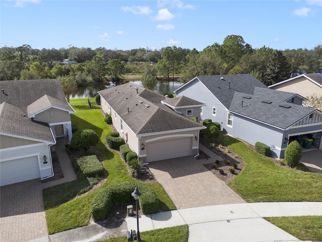 birds eye view of property with a water view