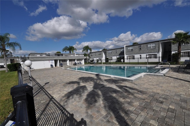 view of swimming pool with a patio