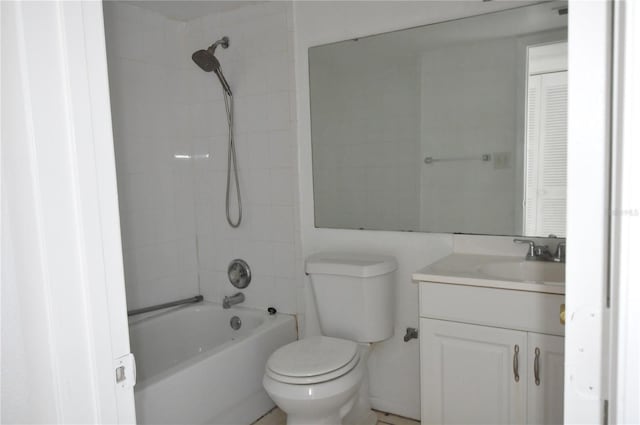 full bathroom with vanity, toilet, and tiled shower / bath