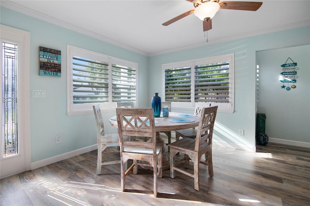 dining room with hardwood / wood-style flooring, ceiling fan, and ornamental molding