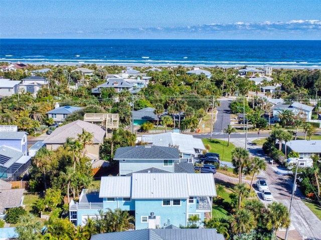 aerial view featuring a water view and a beach view