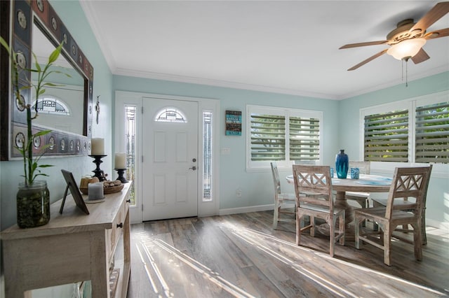 foyer featuring crown molding, dark hardwood / wood-style flooring, and ceiling fan