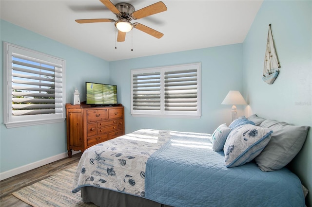 bedroom featuring ceiling fan and hardwood / wood-style floors