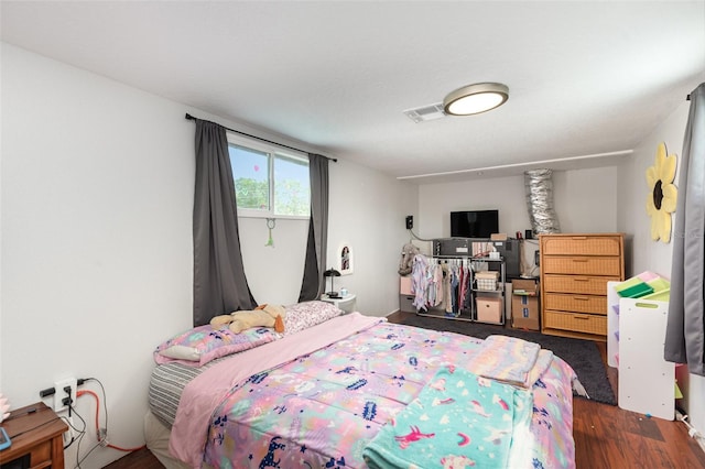 bedroom featuring dark hardwood / wood-style floors