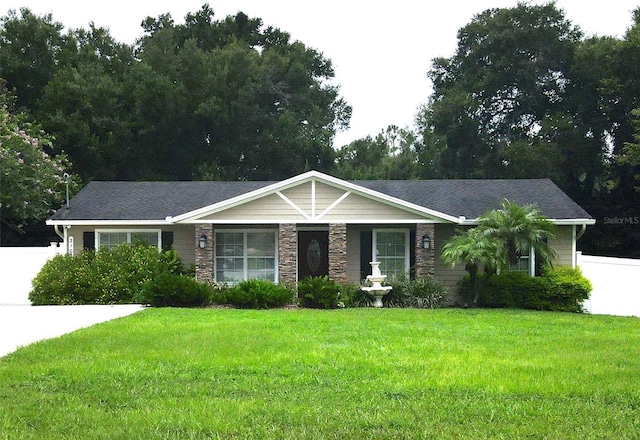 ranch-style house with a front lawn