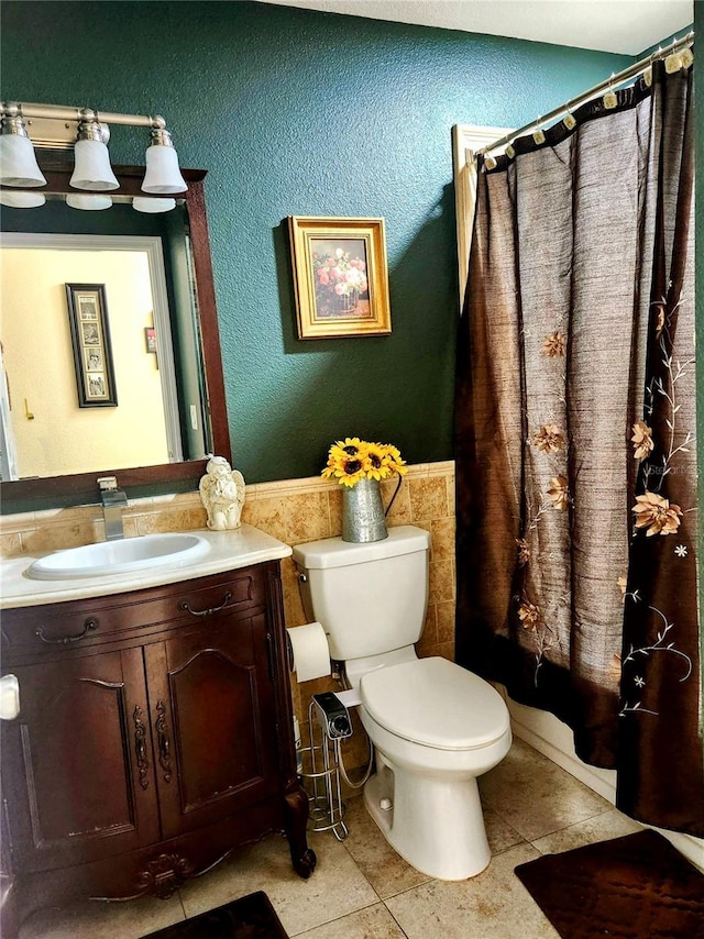 full bathroom with tile patterned floors, vanity, toilet, and shower / bathtub combination with curtain