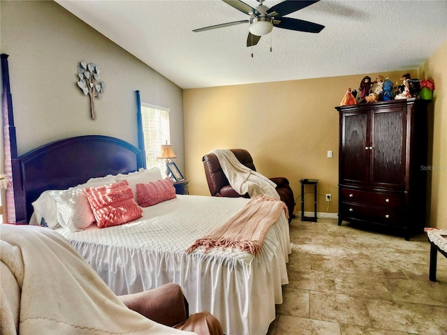 bedroom featuring a textured ceiling, ceiling fan, and vaulted ceiling