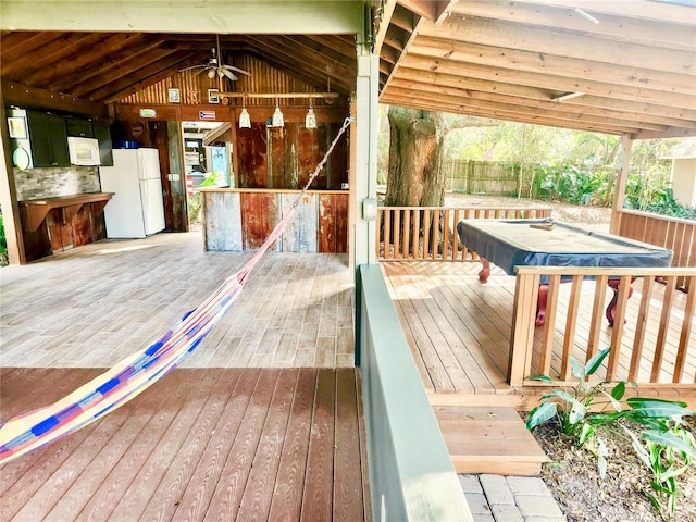 wooden deck with ceiling fan