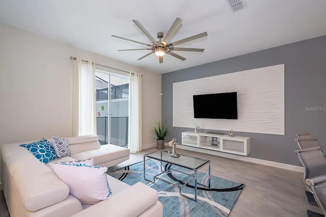 living room with hardwood / wood-style flooring and ceiling fan