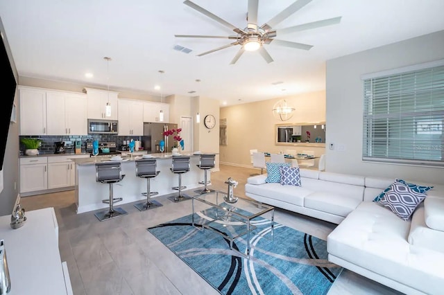 living room featuring ceiling fan